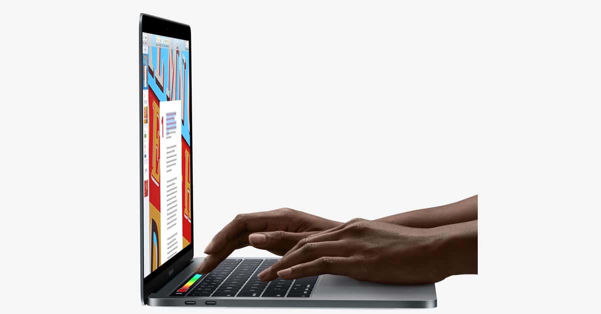 A woman using Touch Bar on MacBook Pro
