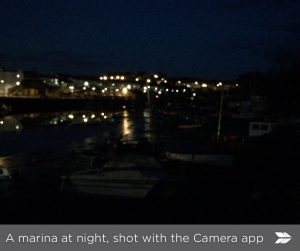 A marina at night with Camera App