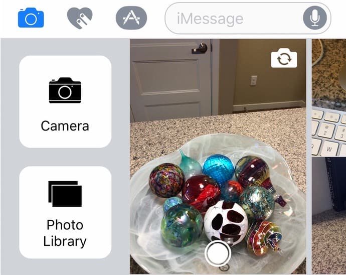 The extra camera options in Messages on the iPhone give you a full screen camera view and access to your whole Photos library