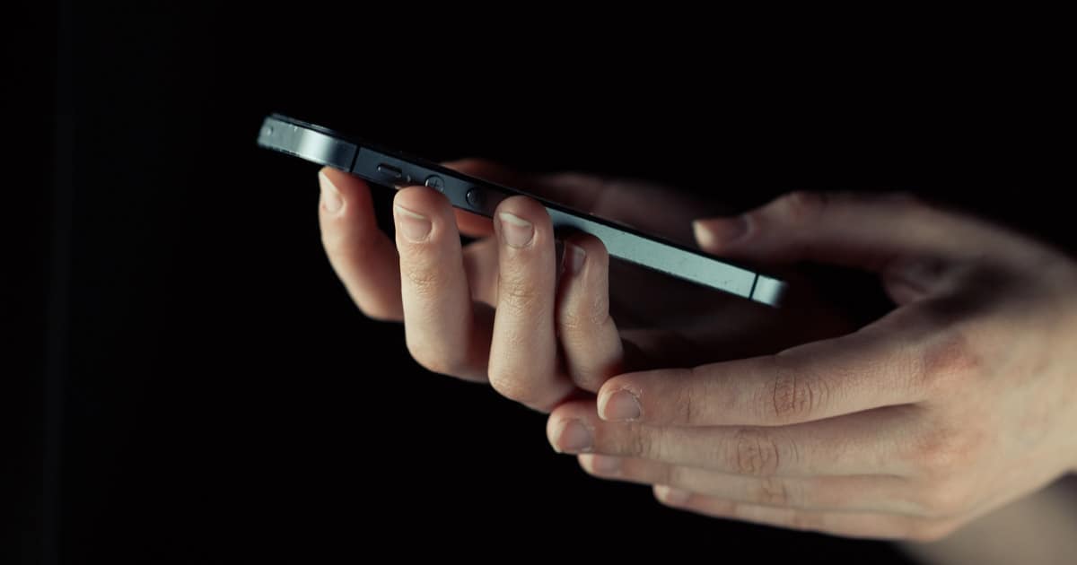 An iPhone being used in the dark