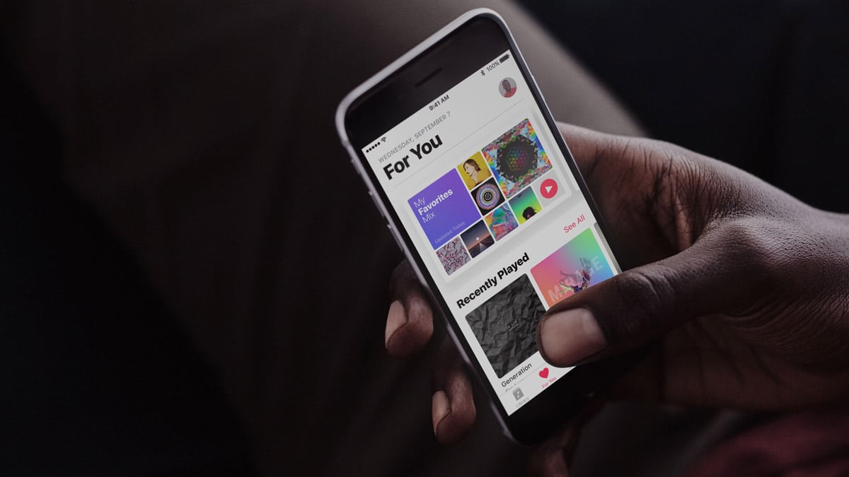 Image of person playing Apple Music on an iPhone. Verizon will have an Apple Music offer.