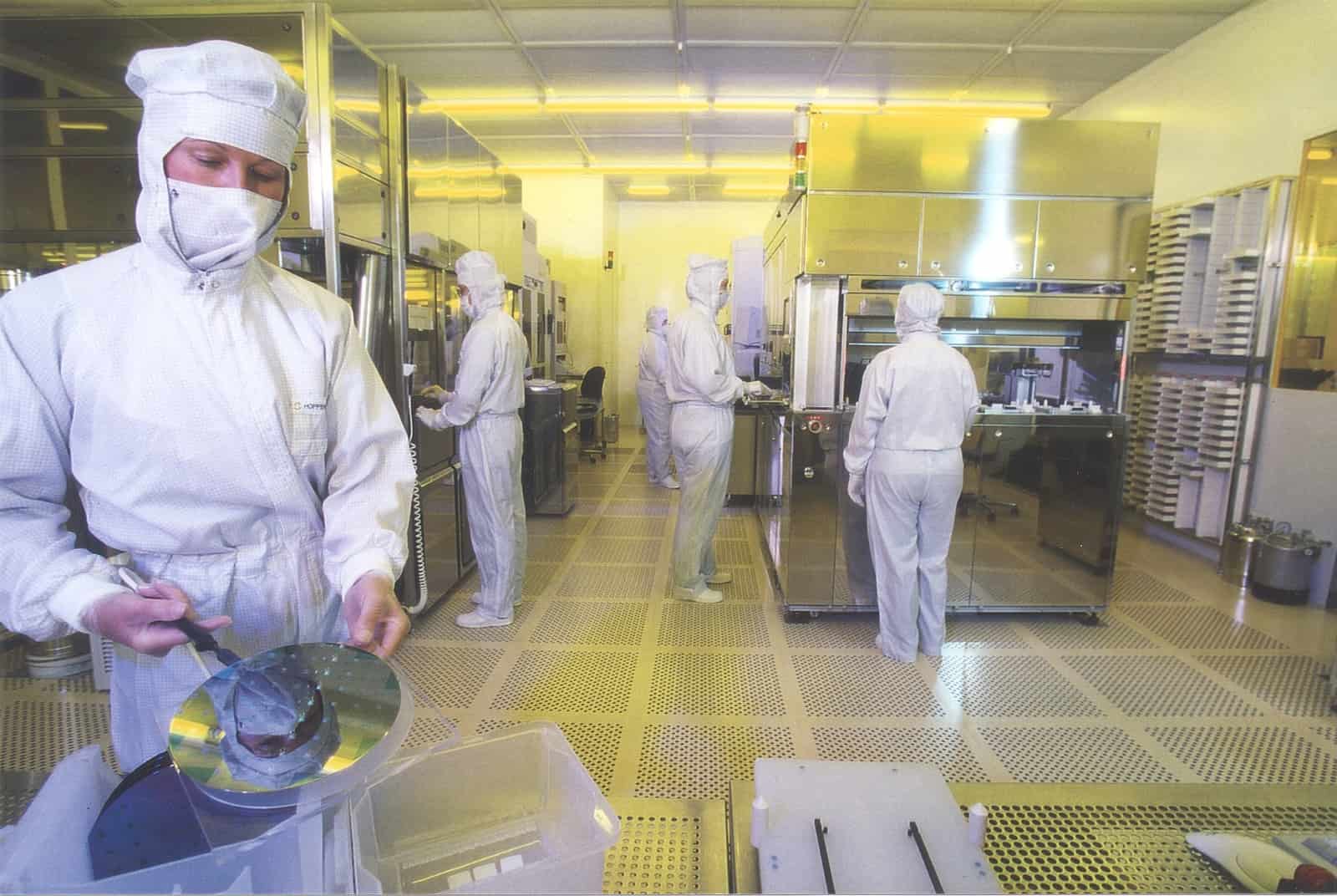 Image of workers in chip supply manufacturing. 