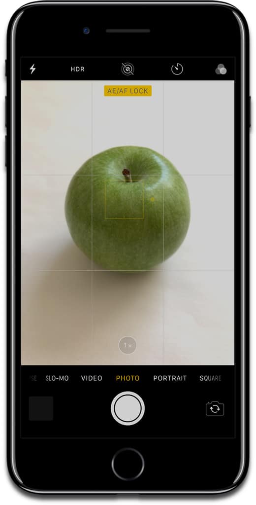 Screenshot of using focus lock on an apple in the iPhone camera app.