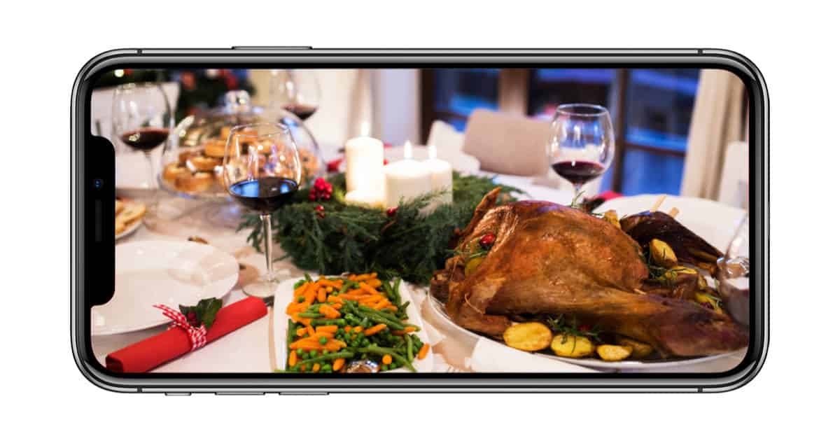 iPhone X with holiday table setting