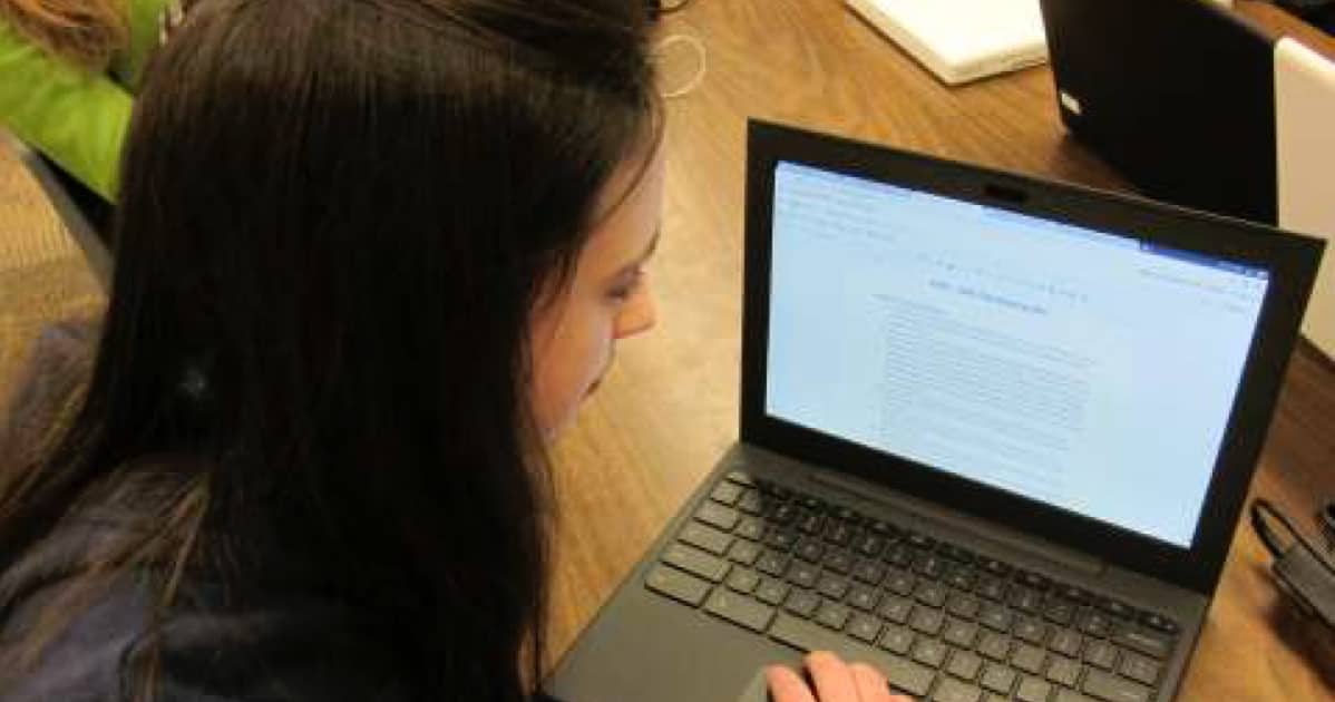 Student with CHromebook