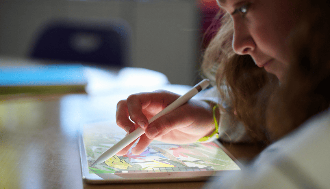 A child working with iPad and Pencil