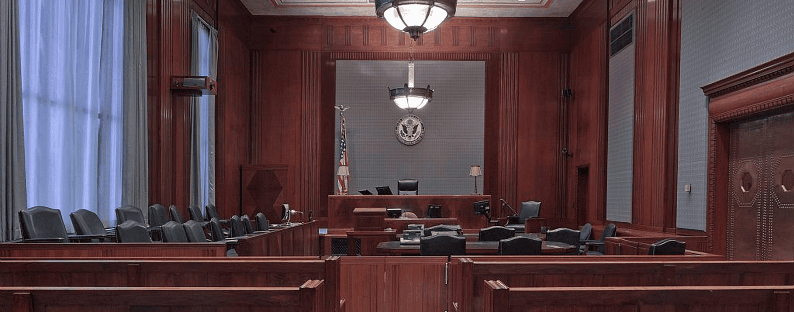 Image of a courtroom. Apple Refuses to Discuss its Tax Evasion With EU Lawmakers. 