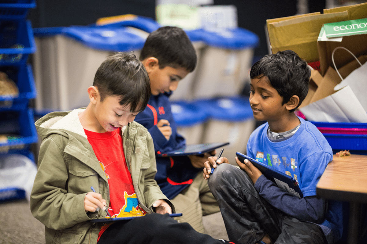 Image of kids using a new Chrome OS tablet, which competes with the education iPad model.
