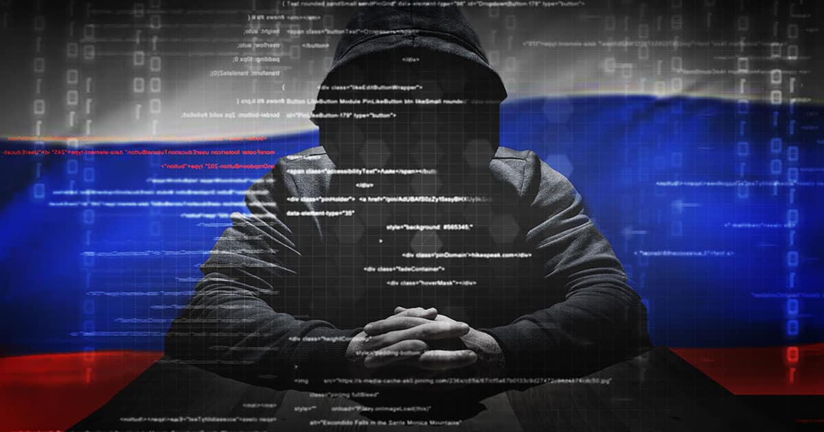 Russian hacker in front of Russian flag