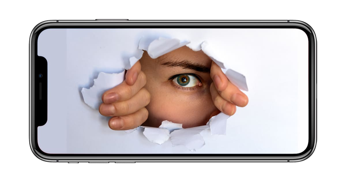 iPhone X with spy looking through