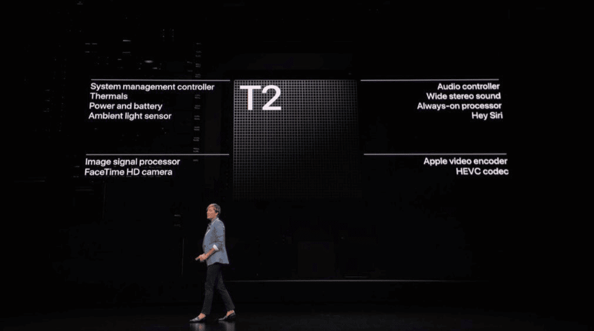 Presenter explaining the T2 security chip on stage.