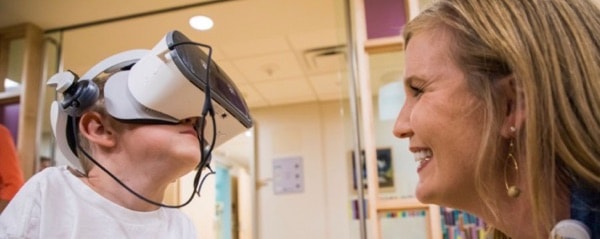 child patient with VR headset.