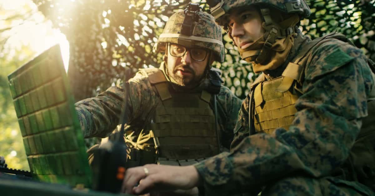 Two soldiers with a computer