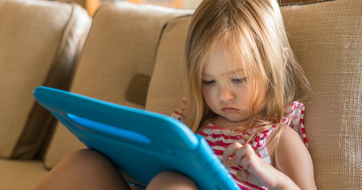 Toddler playing on iPad