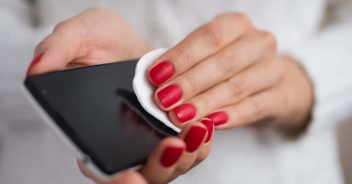 Image of woman cleaning a phone