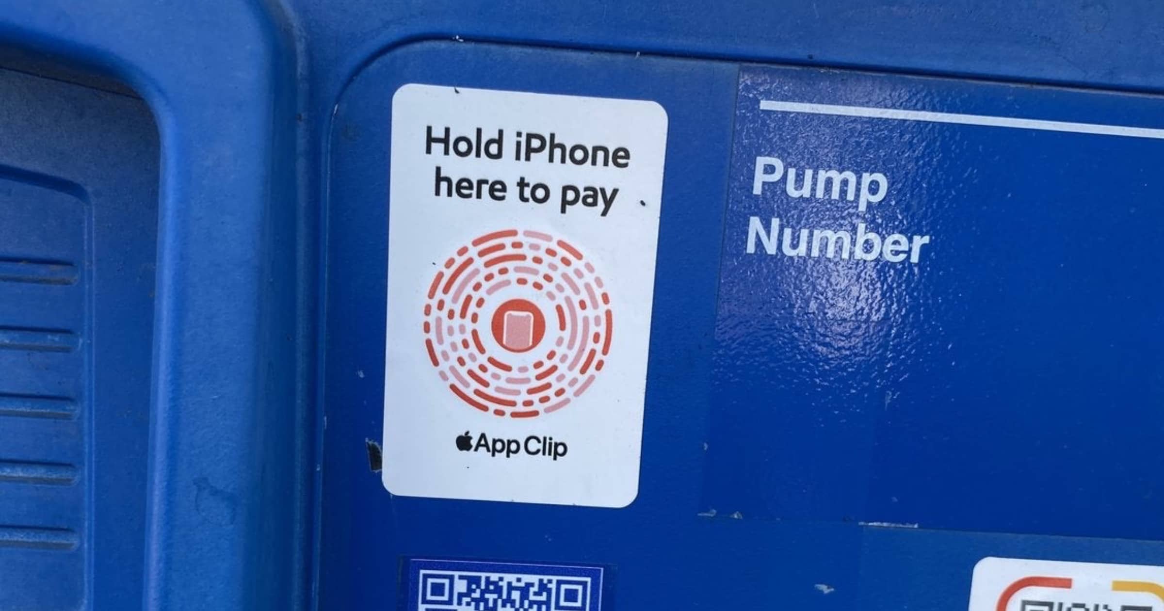 An app clips sticker on an Exxon Mobil gas pump.
