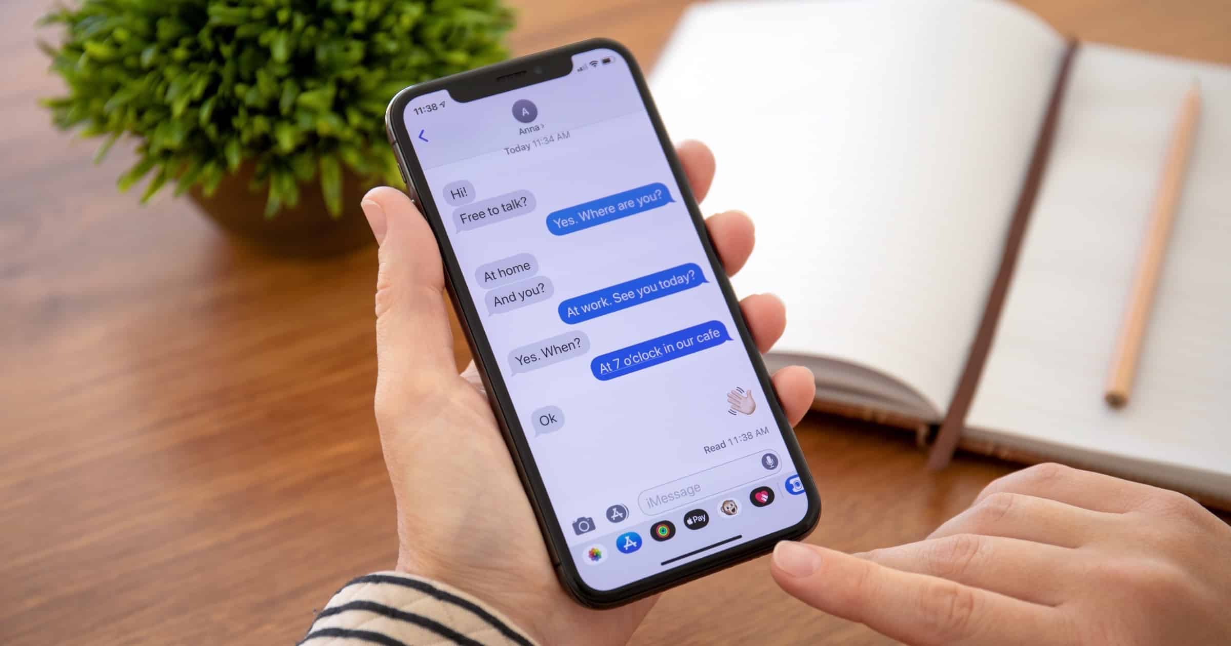 Woman using imessage on an iPhone X