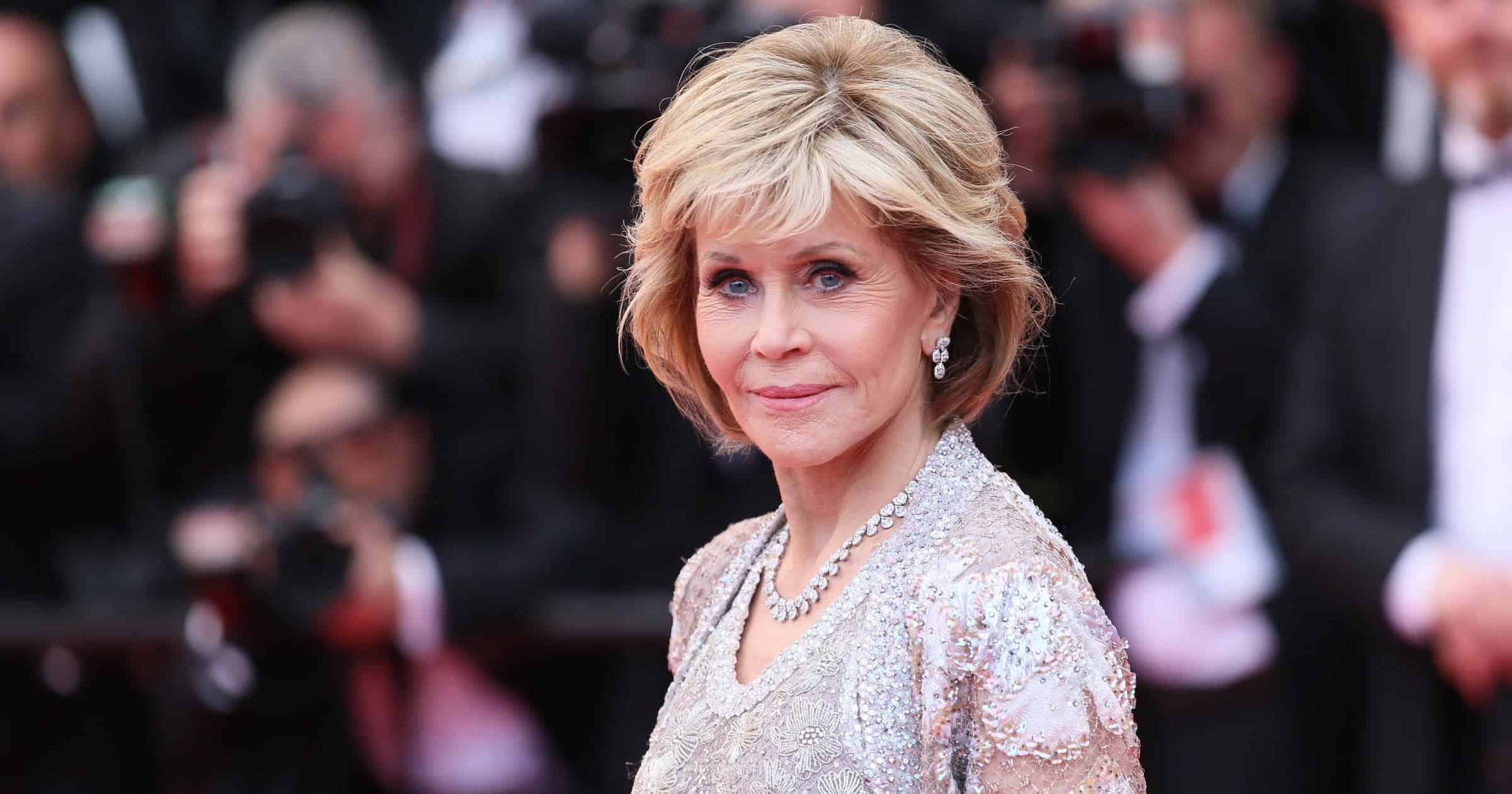 Jane Fonda in font of photographers