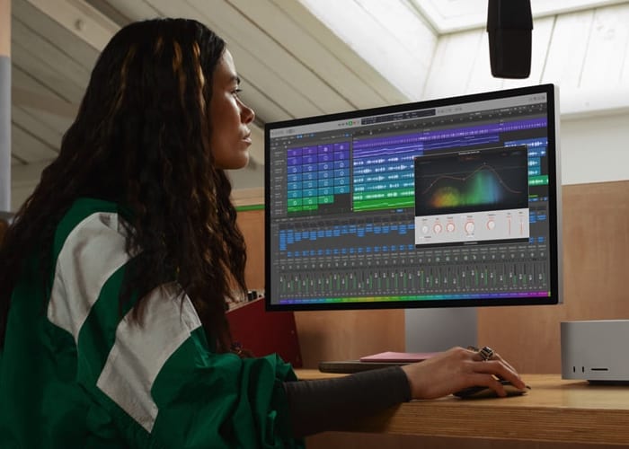 picture showing woman using mac studio with M2 Ultra