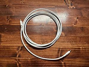 MacBook USB-C cable coiled up