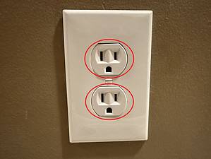 Inspect the receptacle for signs of yellowing or burning