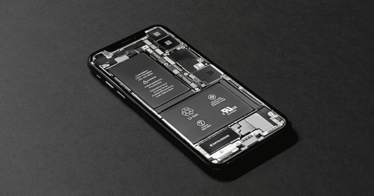The interior of an iPhone showing components like the battery or the Taptic Engine