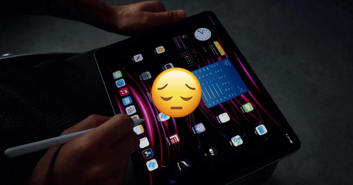 An iPad Pro with a sad emoji