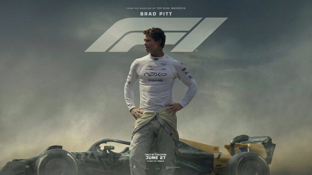 The F1 Movie poster featuring Brad Pitt standing in front of a Formula 1 car.
