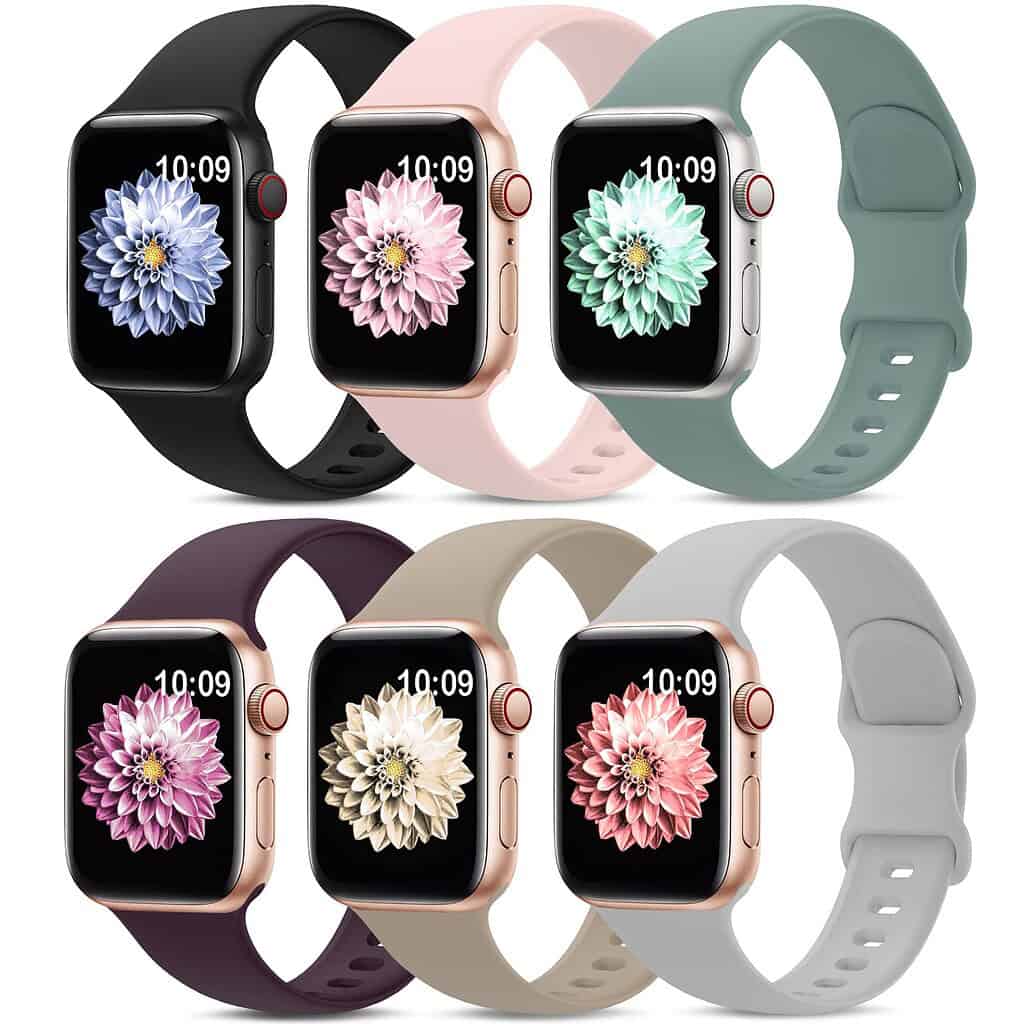 A collection of six smartwatches in various colors, displaying floral watch faces. Colors include black, pink, green, purple, beige, and white.