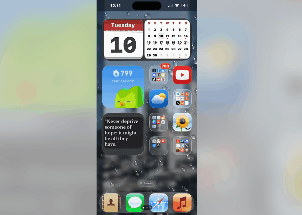 A glassy iOS 26 home screen design