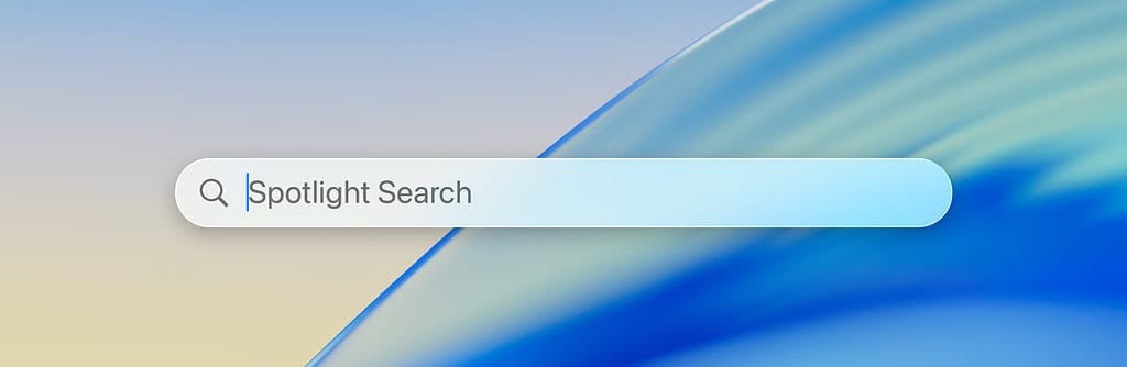 Un MacBook avec la recherche Spotlight ouverte.