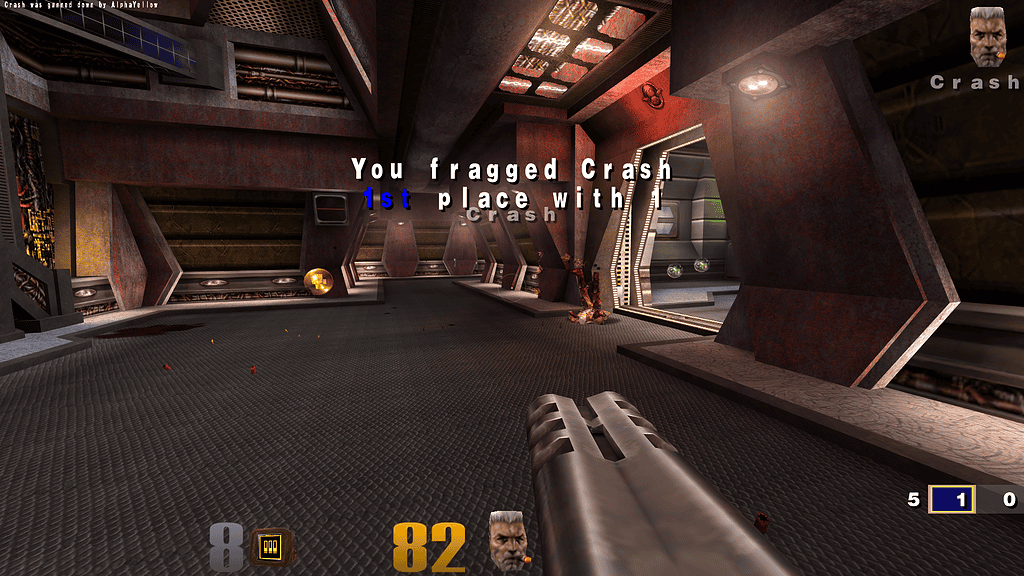 First-person victory screen in Quake III: “You fragged Crash, 1st place with 1” displayed center-screen, with weapon and HUD visible in a metallic corridor.