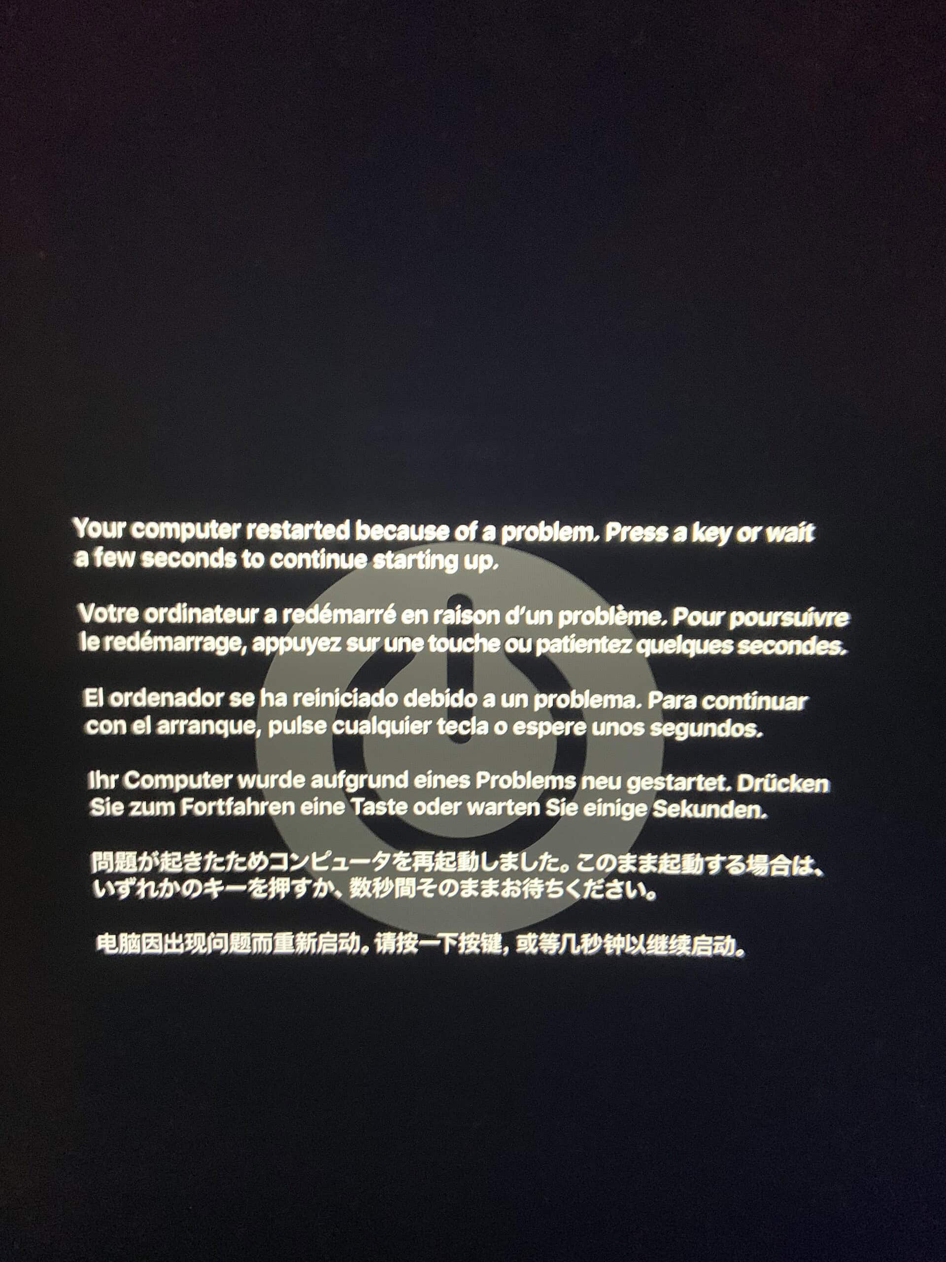 A black screen displays a warning message in several languages.