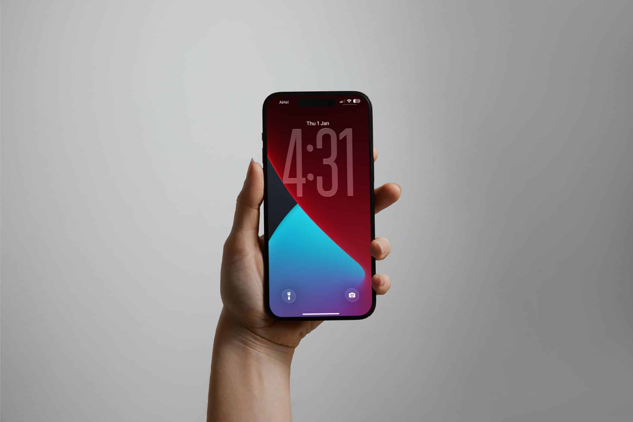 A stretched clock on an iPhone's wallpaper