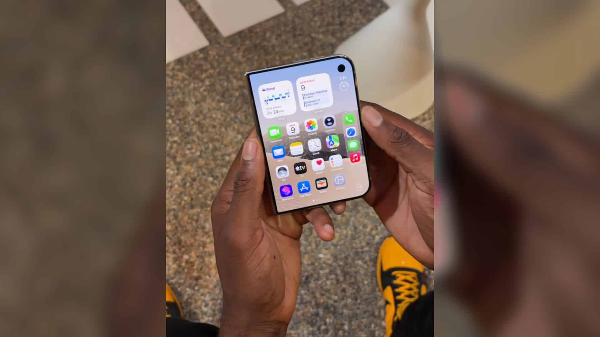 iPhone Duo held partly open during an outer-screen demonstration