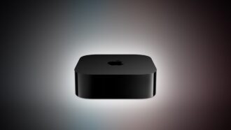 An unreleased black Apple TV 4K box shown on a colorful gradient