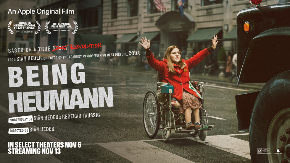 Being Heumann poster showing a woman in a wheelchair raising her arms in a city street