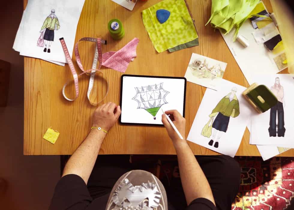 Bunyamin Aydin sketching a hot-air balloon design on iPad Pro with Apple Pencil Pro