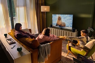 Apple TV 4K with four HomePod speakers in a surround sound setup