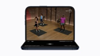 iPhone Duo propped open running Apple Fitness+