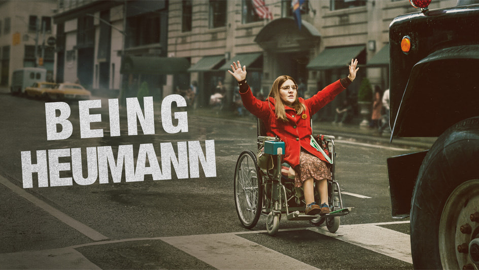 Being Heumann key art showing a woman in a wheelchair in front of a truck