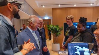 King Charles III and Tim Cook speaking with young Creative Labs participants