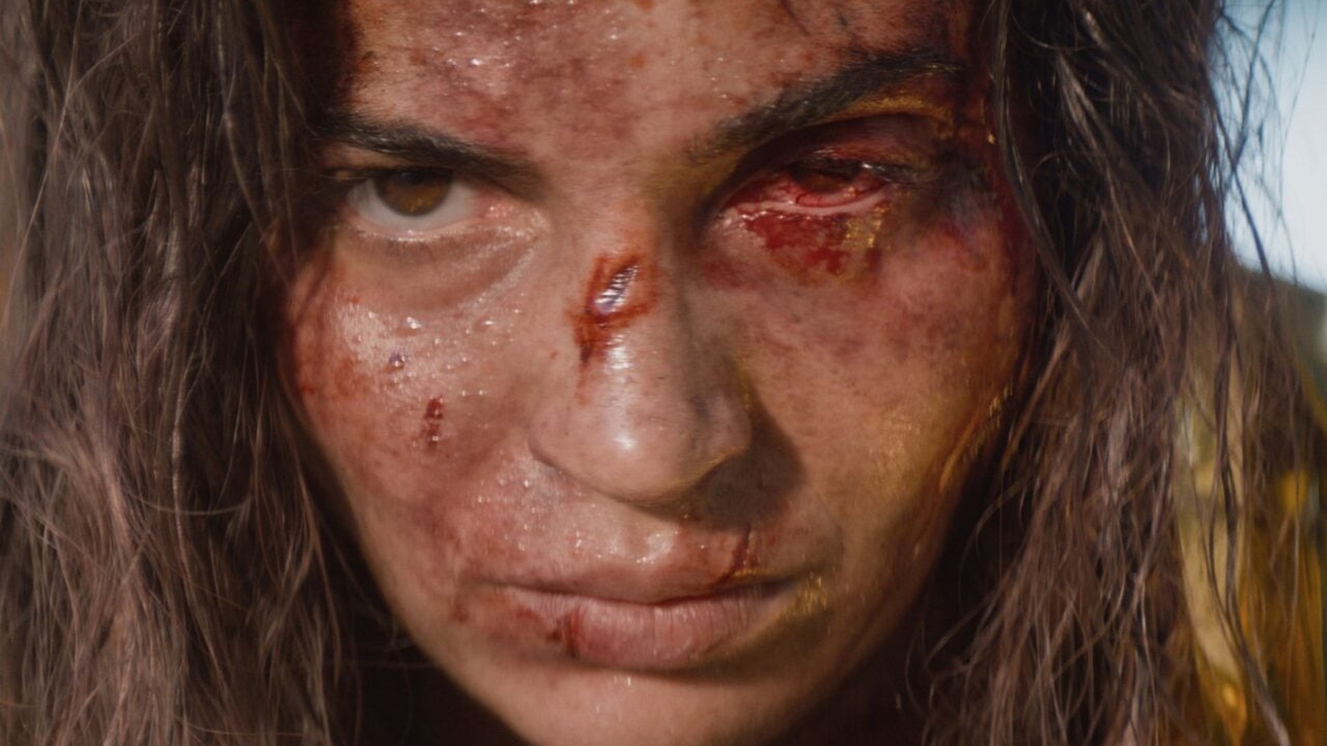 Alice, bloodied but alive, faces the aftermath of the Deadite attack in Evil Dead Burn