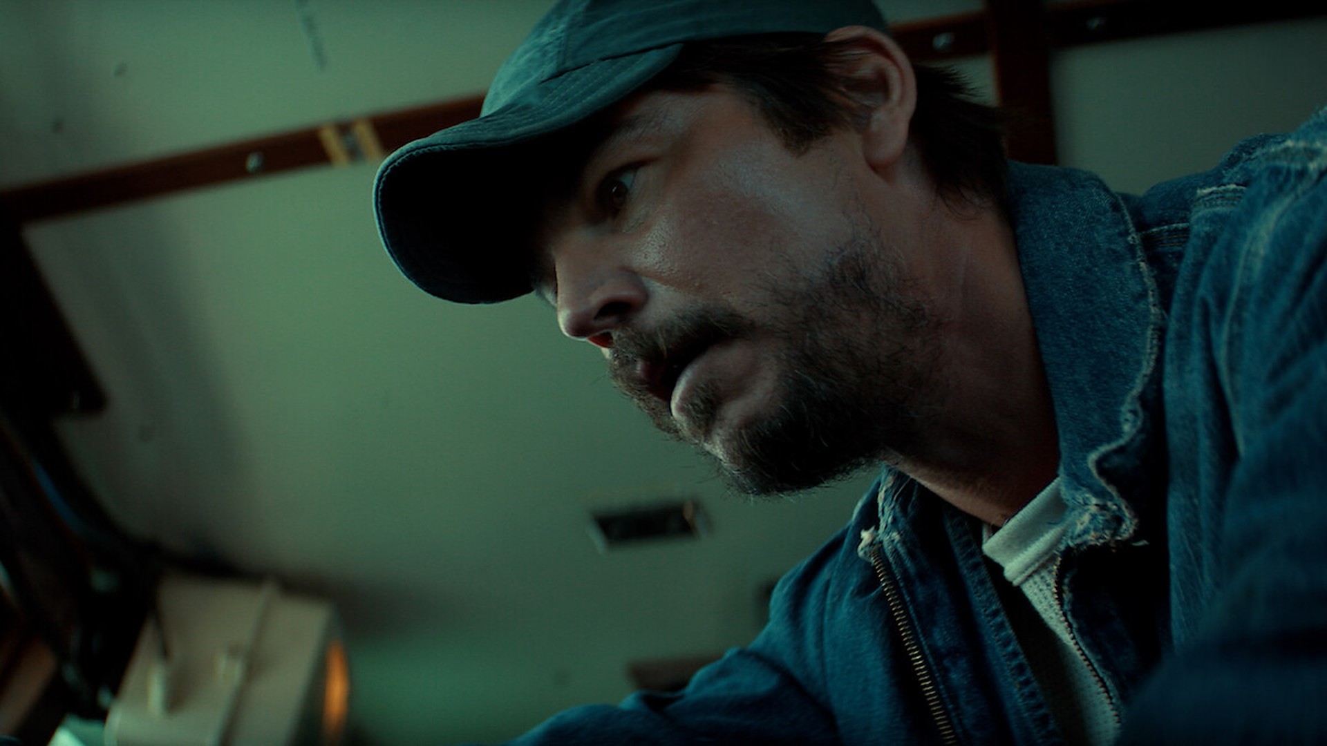 Calvin searches the cabin of a fishing boat in Below