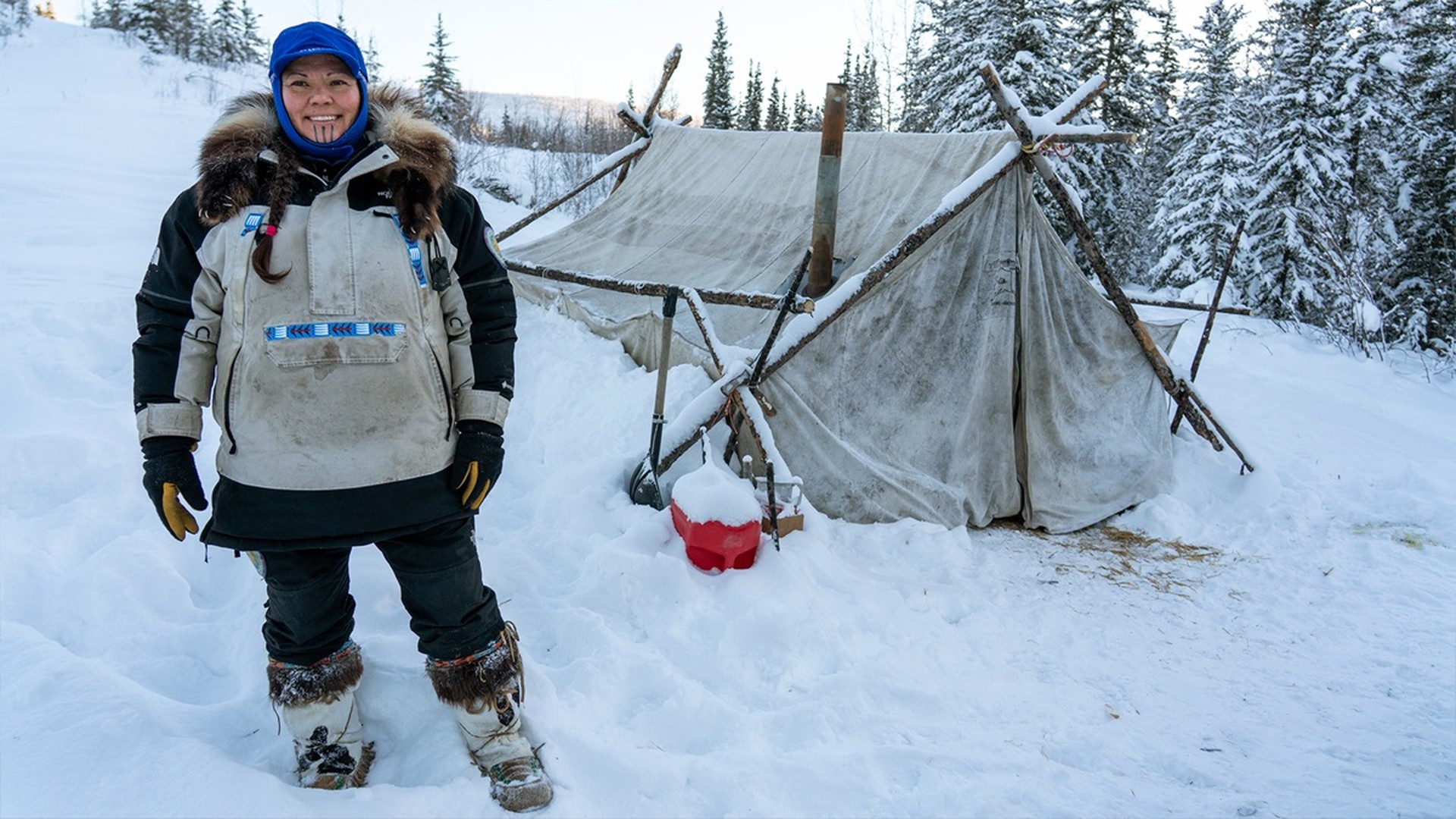 A woman works in the Alaskan wilderness in Surviving Alaska