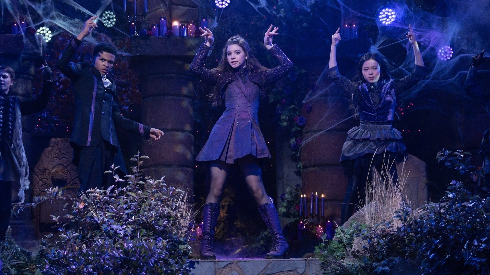 Vee and her friends perform on a candlelit stage in Vampirina Season 2