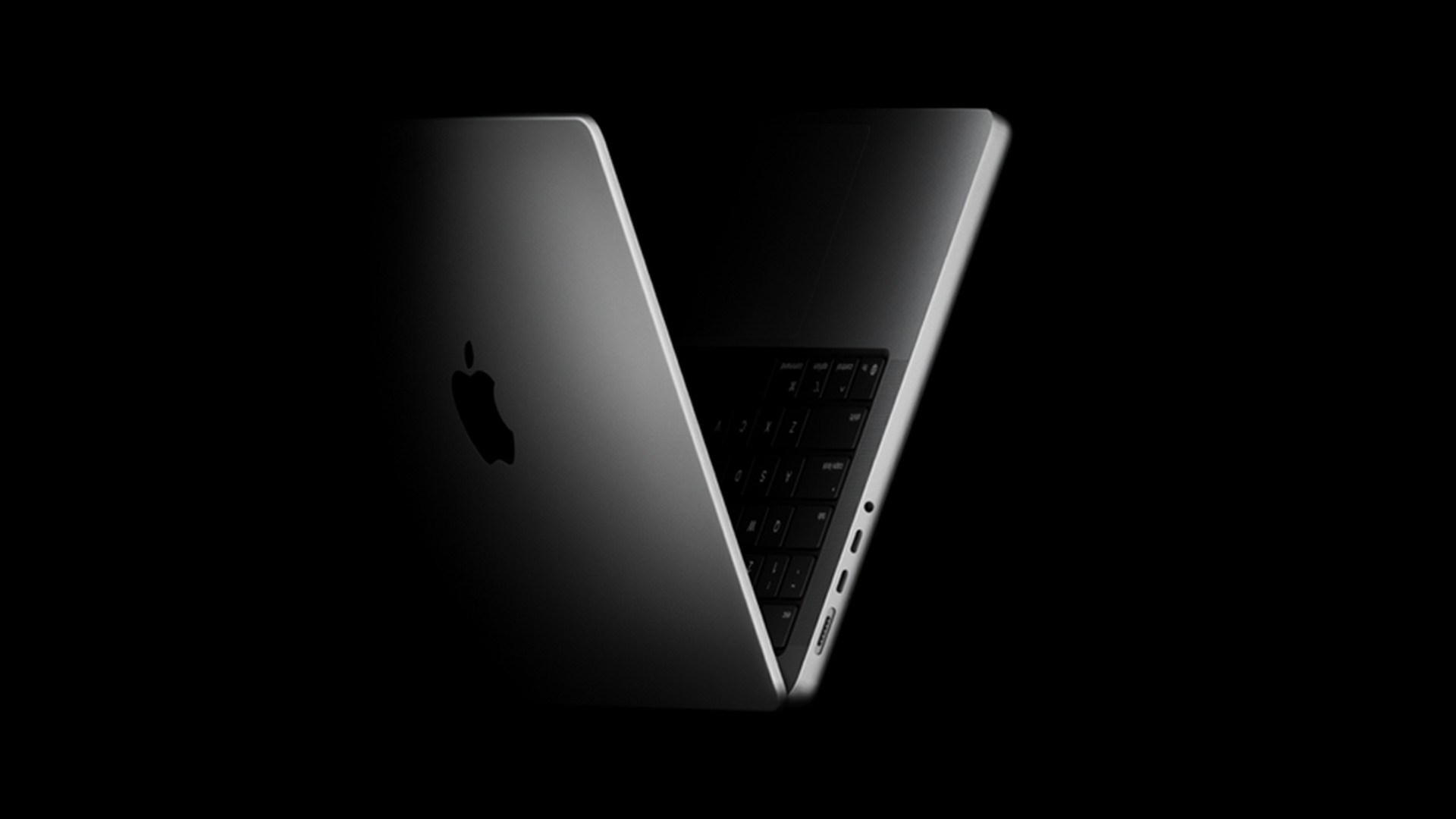 Current Apple MacBook Pro shown open against a dark background