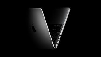 Current Apple MacBook Pro shown open against a dark background